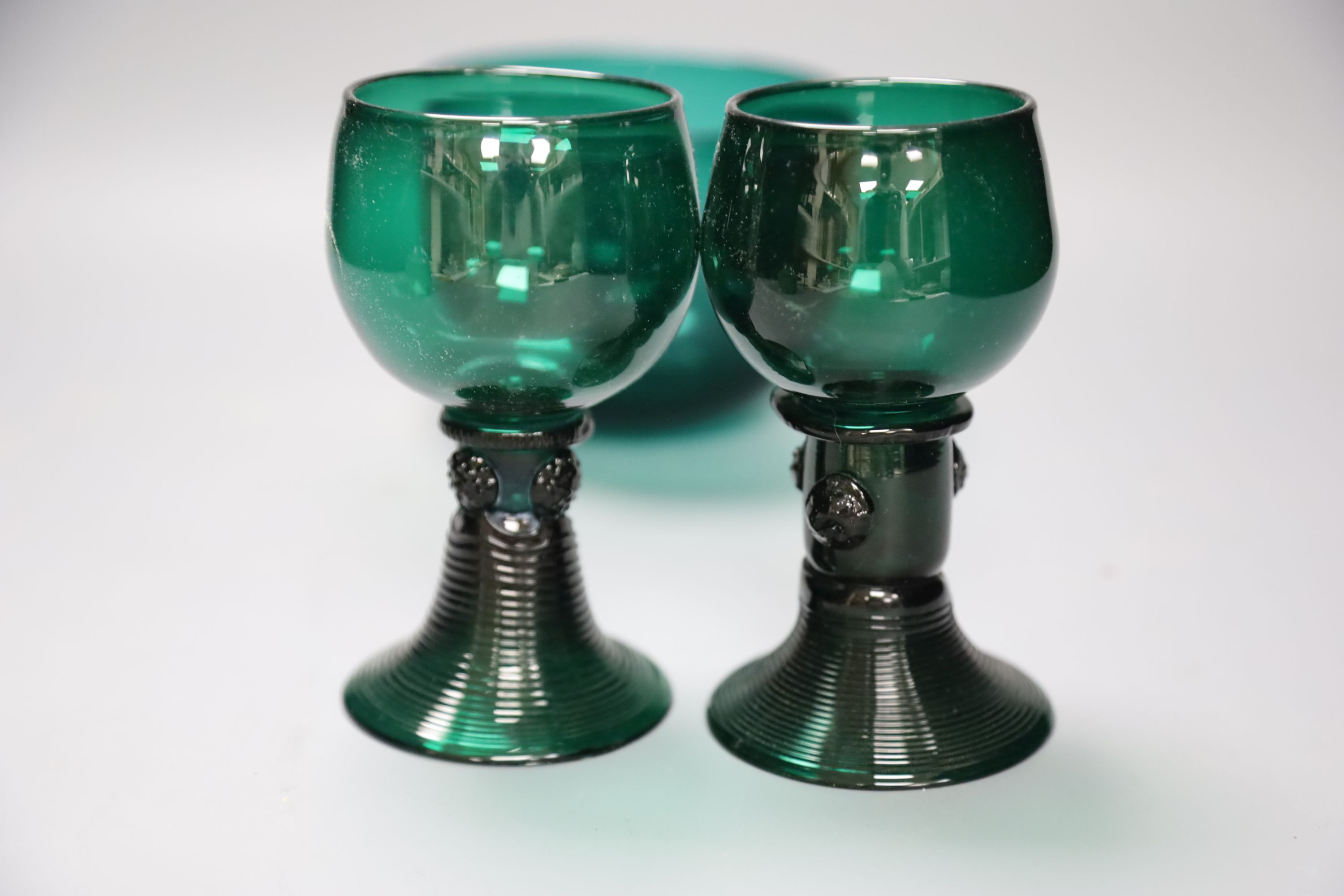 A group of 19th century green glass and a Victorian dump paperweight